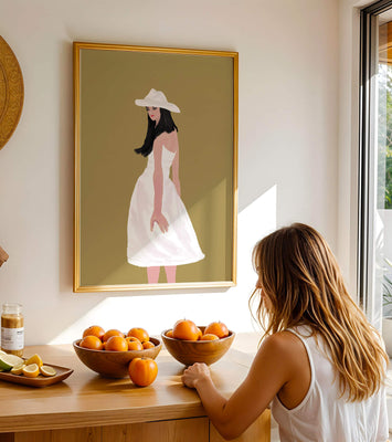 Woman in a white dress and hat on a gold background