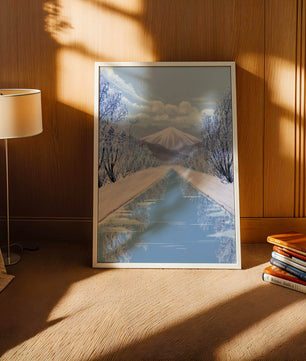 Serene winter landscape with mountain and snowy trees reflecting in water
