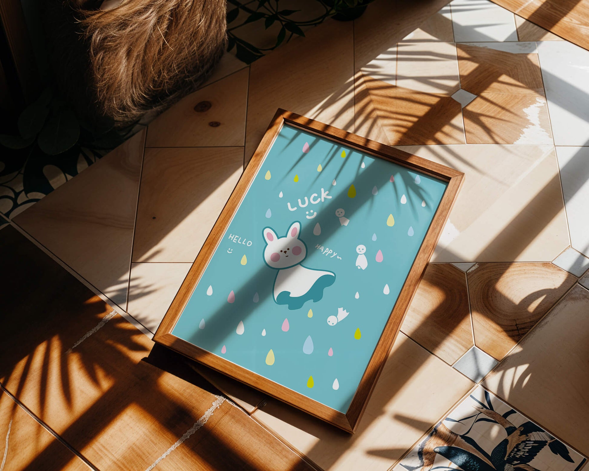 Adorable cartoon bunny with colorful drops on a blue background
