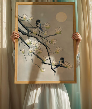 Birds on blossoming branches under a serene moonlit sky