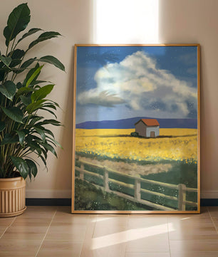 Idyllic rural scene with house and yellow field under blue sky