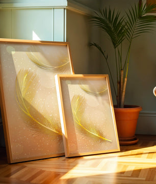 Elegant golden feathers with sparkling particles on soft background