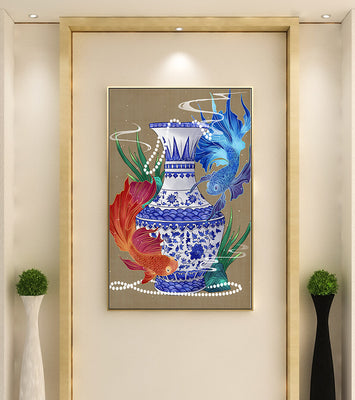 Elegant ceramic vase with vibrant fish and floral design