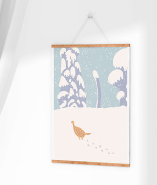 Winter landscape with pheasant walking through snowy forest