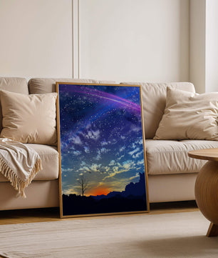 Starlit night sky with colorful sunset and silhouetted landscape