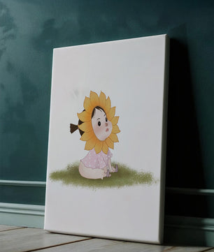 Adorable child with sunflower costume sitting on a grassy patch