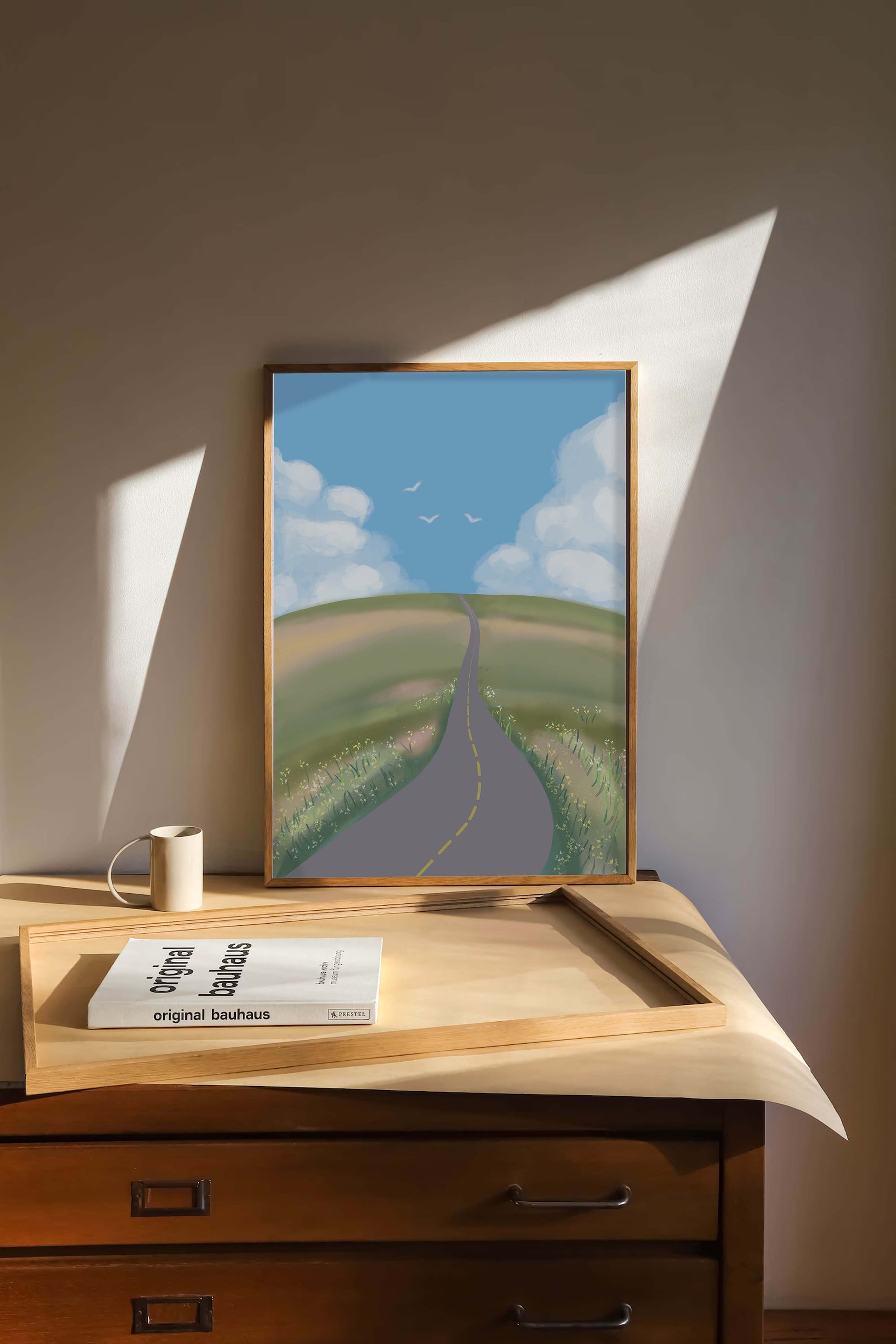 Serene countryside road with vibrant sky and rolling hills