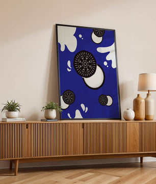Graphic design featuring cookies and milk splashes on blue background