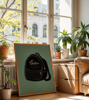 Elegant black backpack with gold accents and love inscription