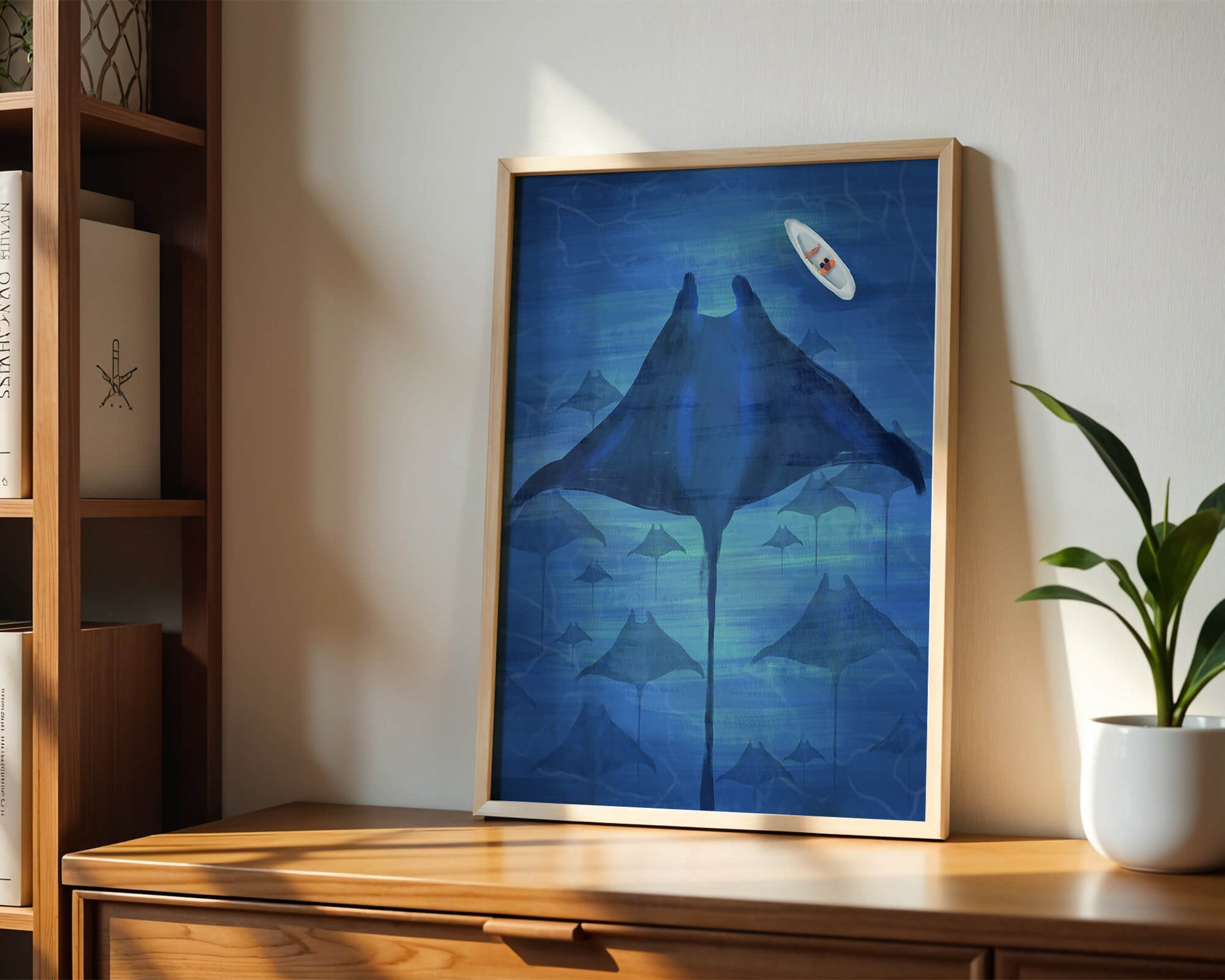 Serene underwater scene with manta rays and a lone kayak