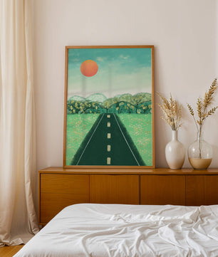 Serene Landscape with Road Leading to Sunset and Lush Greenery