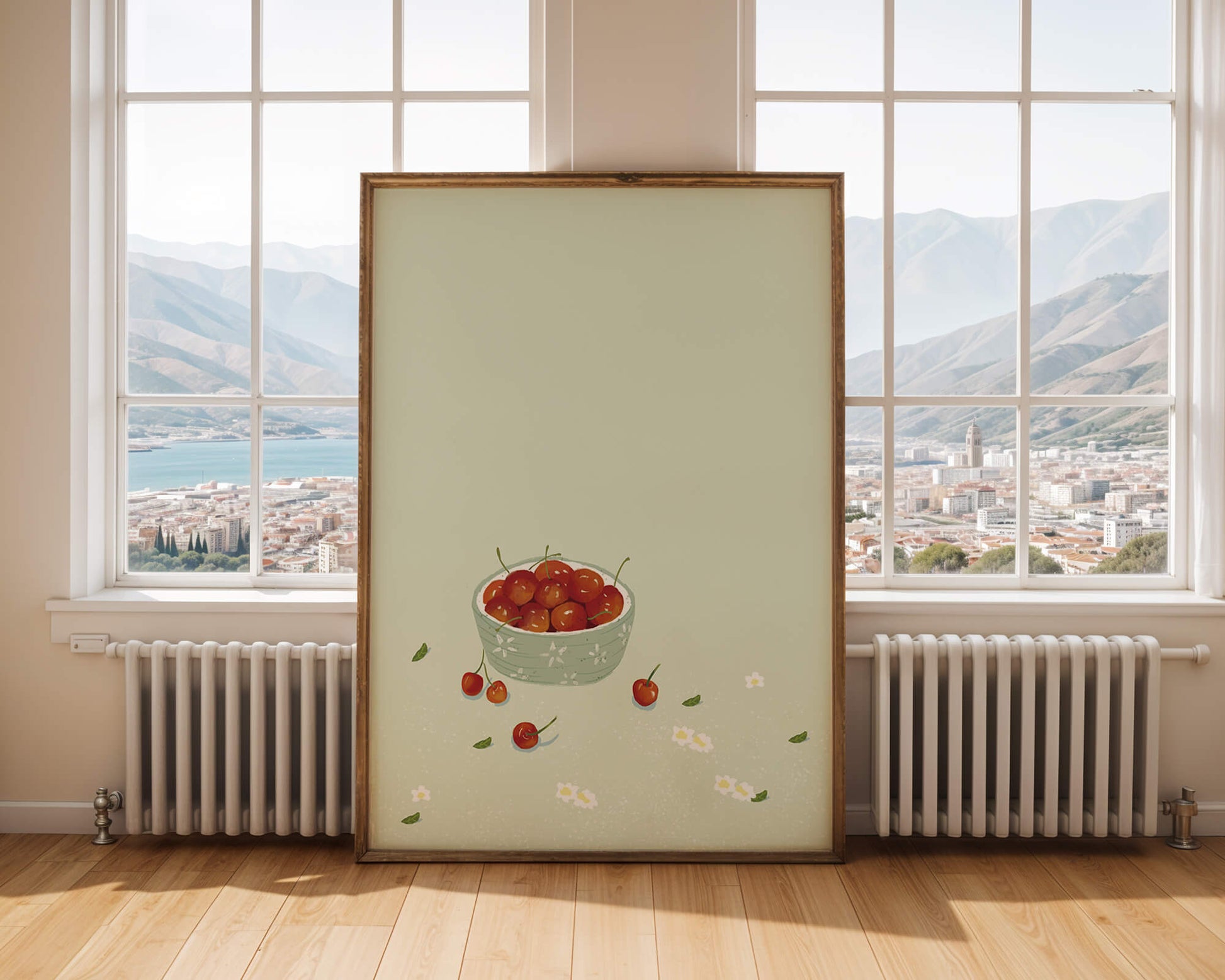 Cherries in a decorative bowl with floral accents on a soft green background