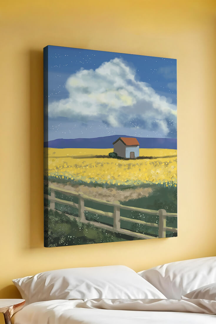 Idyllic rural scene with house and yellow field under blue sky