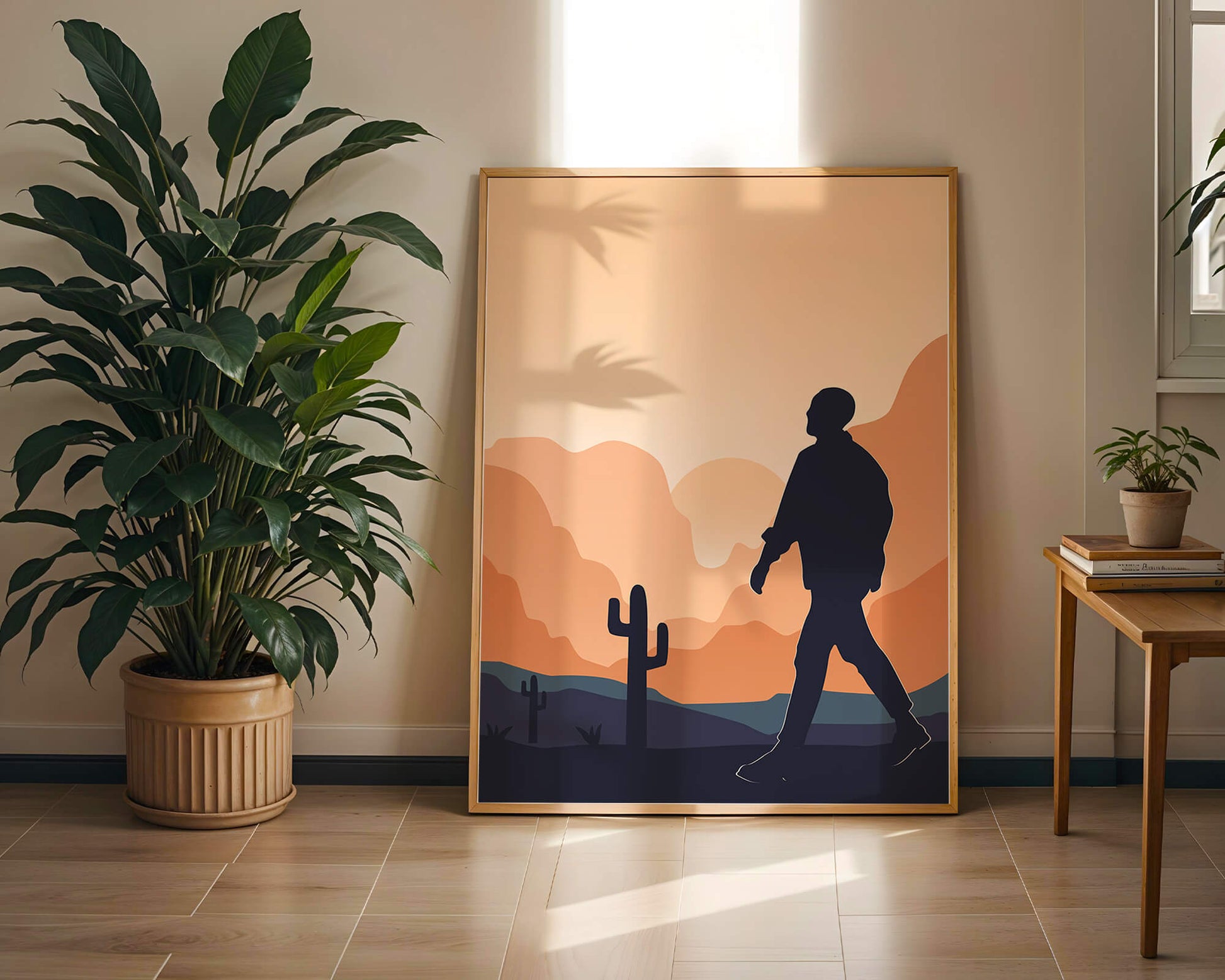 Silhouetted figure walking in desert landscape at sunset