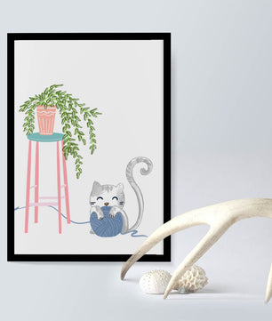 Cat Playing with Yarn Beside a Potted Plant on Pink Stool - Mi tienda