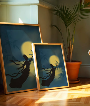 Silhouette of a Woman Reaching for Leaves in Front of a Full Moon