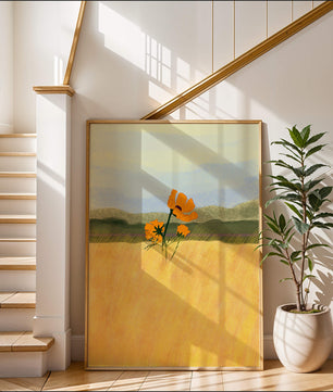 Orange Flowers in a Golden Field with Mountains and Blue Sky