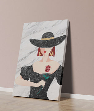 Elegant woman in wide-brimmed hat holding a rose on marble background