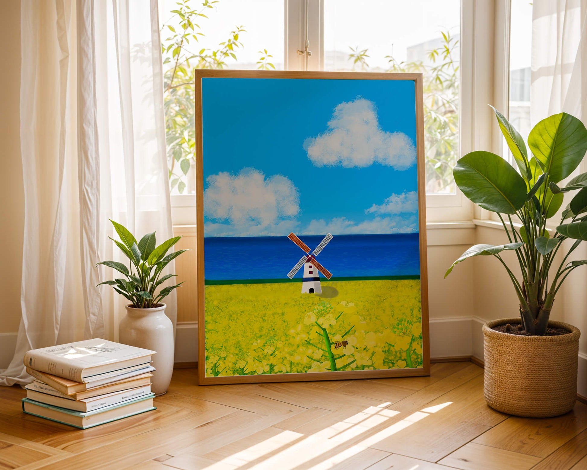 Scenic landscape with windmill in blooming field by the sea
