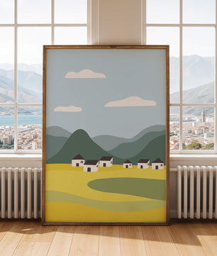 Pastoral Landscape with Mountains and Houses Under Blue Sky