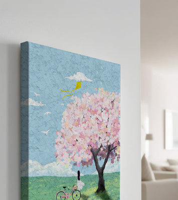 Springtime scene with cherry blossom and girl with bicycle