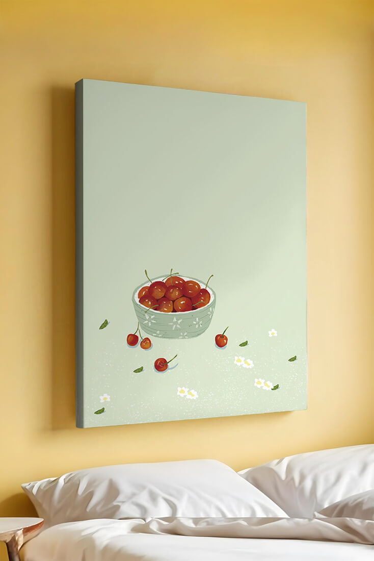 Cherries in a decorative bowl with floral accents on a soft green background
