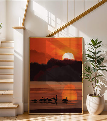 Serene sunset over a lake with silhouetted swans