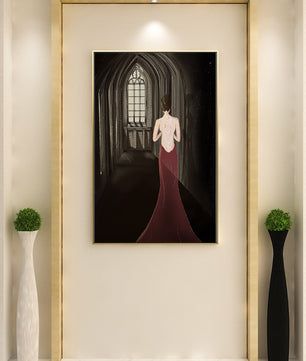 Elegant woman in a red dress inside a gothic hallway