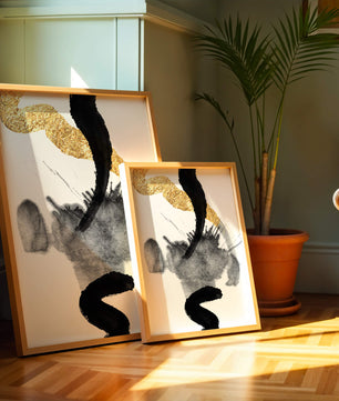 Abstract black and gold brushstrokes with textured patterns