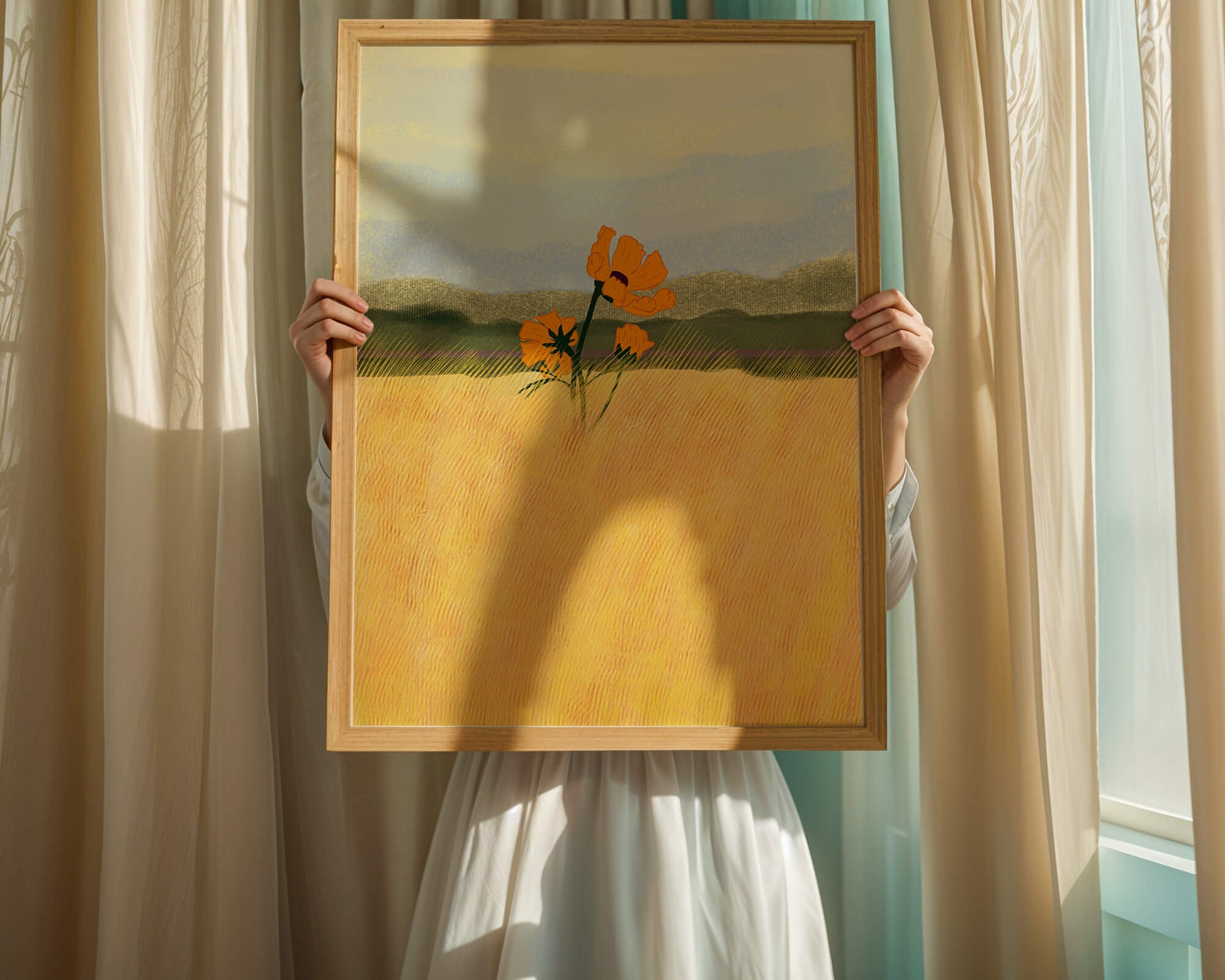 Orange Flowers in a Golden Field with Mountains and Blue Sky