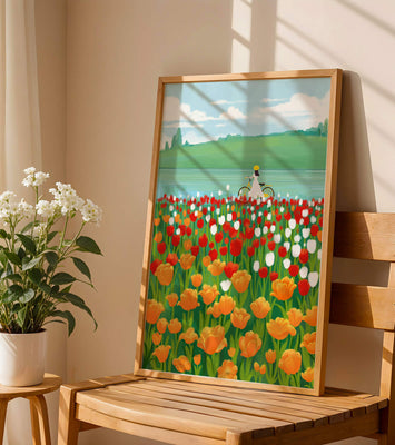 Woman with bicycle in vibrant tulip field by a lake