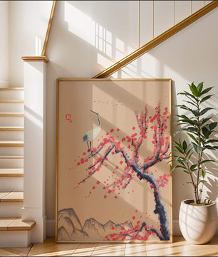 Elegant crane on cherry blossom tree with mountainous background