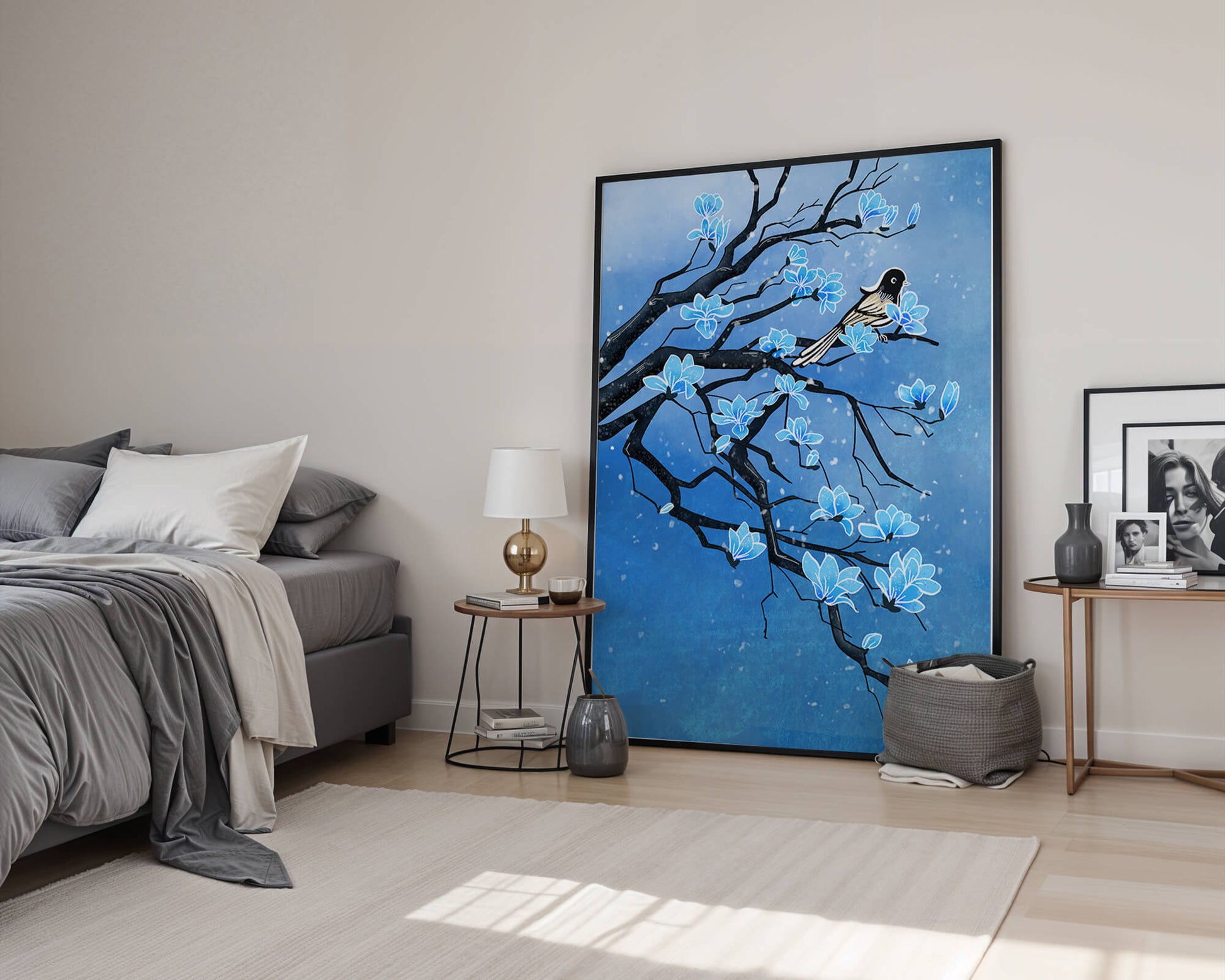 Bird on a branch with blue flowers against a snowy background