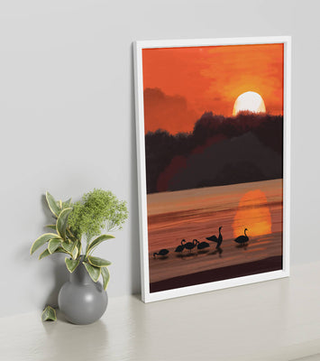 Serene sunset over a lake with silhouetted swans
