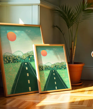 Serene Landscape with Road Leading to Sunset and Lush Greenery