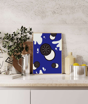 Graphic design featuring cookies and milk splashes on blue background