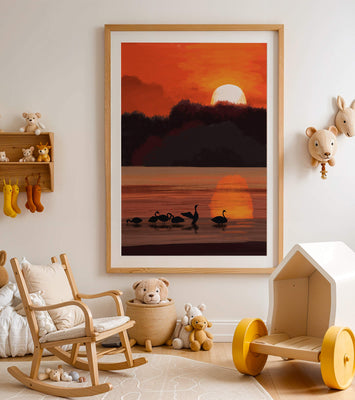 Serene sunset over a lake with silhouetted swans