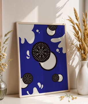 Graphic design featuring cookies and milk splashes on blue background