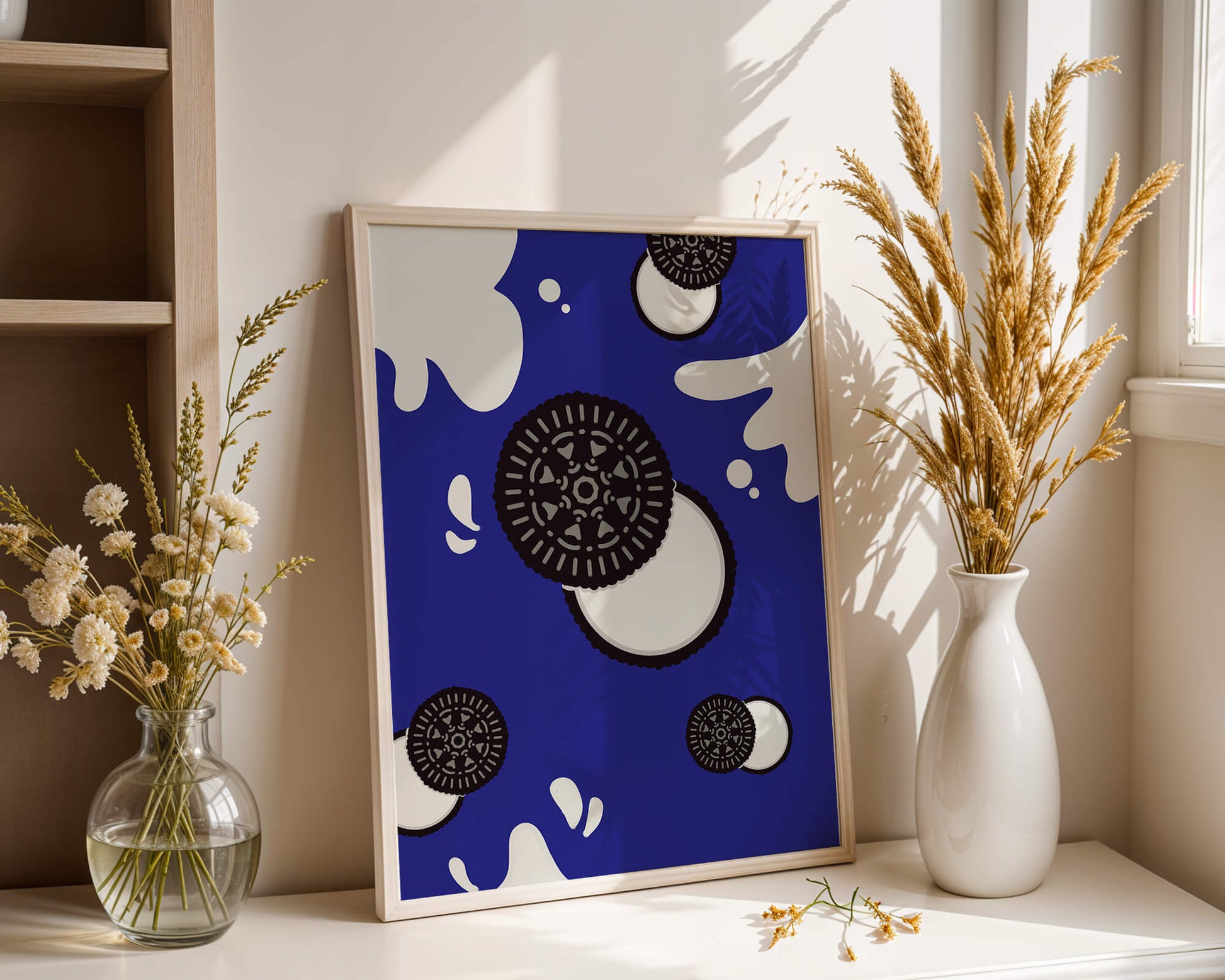 Graphic design featuring cookies and milk splashes on blue background
