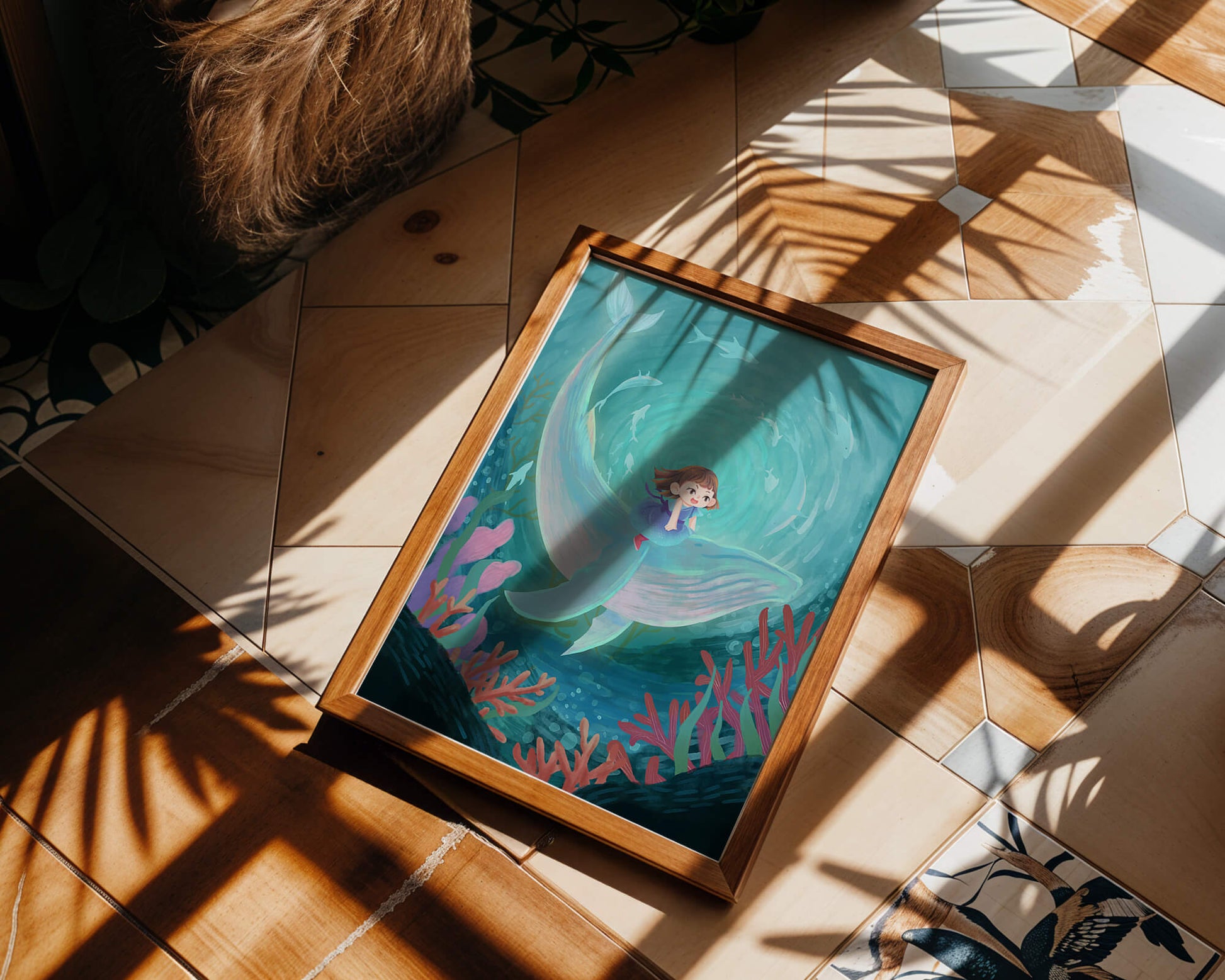 Underwater scene with child and whale surrounded by marine life