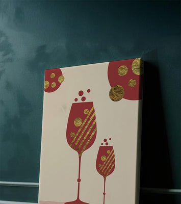 Stylish wine glasses with gold accents and a festive theme