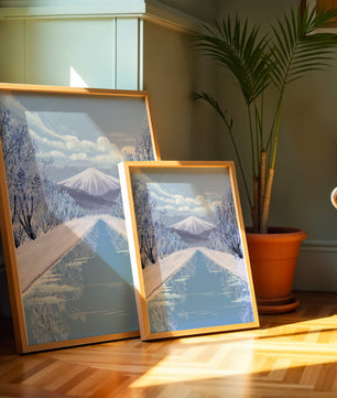 Serene winter landscape with mountain and snowy trees reflecting in water