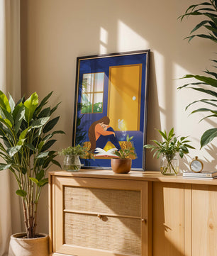 Woman sitting with an open magical book and a fairy in a room