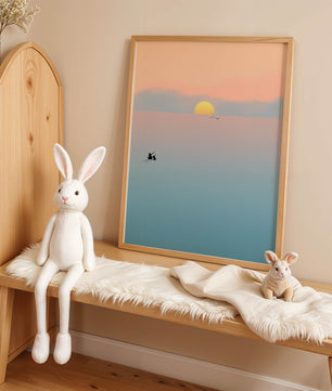 Serene Sunset with Silhouettes and Birds over a Calm Sea