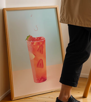 Refreshing strawberry drink with floating slices on pastel background