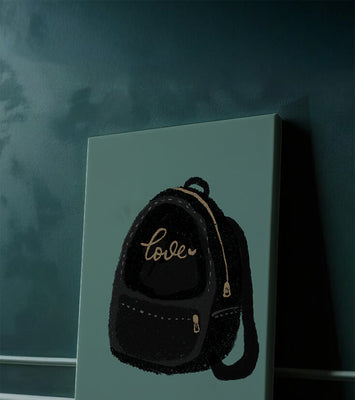 Elegant black backpack with gold accents and love inscription