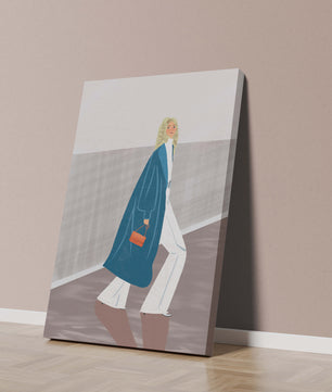 Fashionable Woman in Long Blue Coat Walking Along Corridor with Orange Handbag