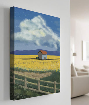 Idyllic rural scene with house and yellow field under blue sky