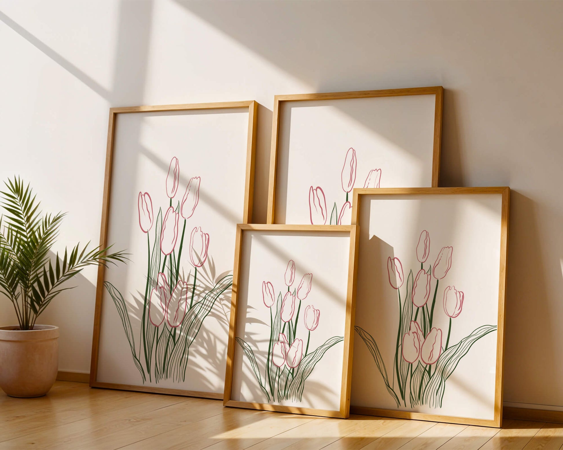 Wunderschöne rosa Tulpen mit grünen Blättern auf einer minimalistischen Leinwand