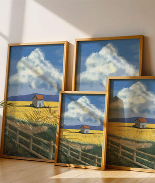 Idyllic rural scene with house and yellow field under blue sky